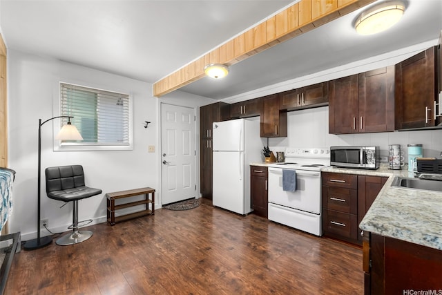 1681 Mahani Loop, Honolulu, HI 96819 - kitchen with white appliances, dark wood finished floors, a sink, and dark brown cabinets