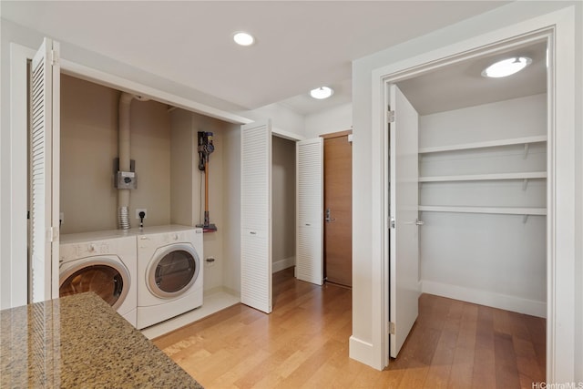 1837 Kalakaua Ave Unit 3106, Honolulu, HI 96815 - laundry room featuring light wood-type flooring, washer and dryer, baseboards, and recessed lighting