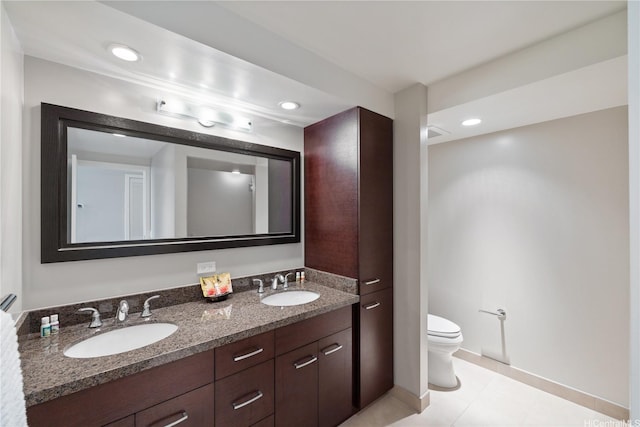 1837 Kalakaua Ave Unit 3106, Honolulu, HI 96815 - bathroom with double vanity, toilet, tile patterned flooring, recessed lighting, and baseboards