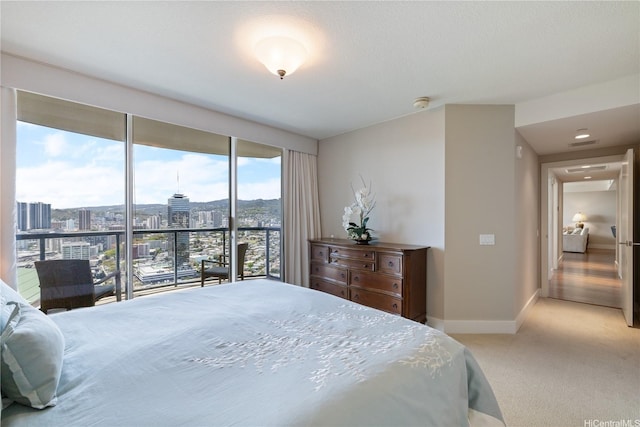 1837 Kalakaua Ave Unit 3106, Honolulu, HI 96815 - bedroom with light carpet, a city view, and baseboards