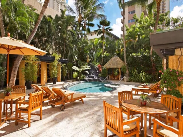 2425 Kuhio Ave Unit 410, Honolulu, HI 96815 - community pool featuring a patio area and outdoor dining space