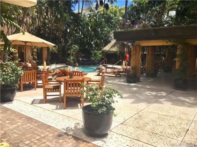 2425 Kuhio Ave Unit 410, Honolulu, HI 96815 - view of patio featuring an outdoor pool