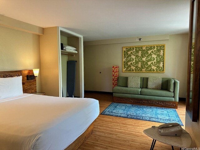 2425 Kuhio Ave Unit 410, Honolulu, HI 96815 - bedroom featuring wood finished floors and a closet