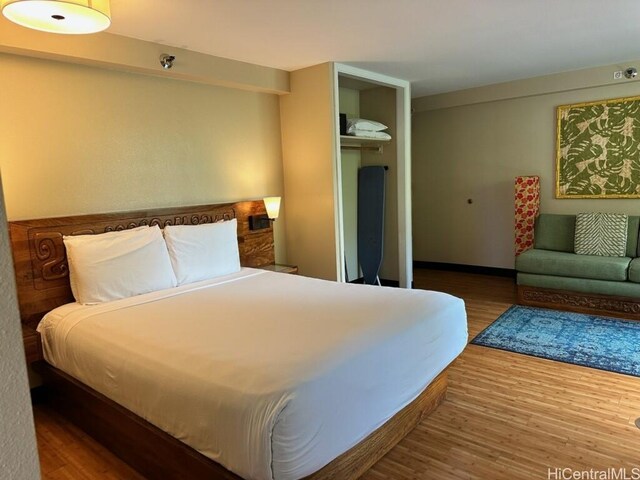 2425 Kuhio Ave Unit 410, Honolulu, HI 96815 - bedroom featuring wood finished floors and a closet