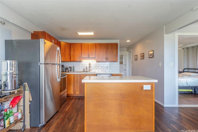 1492 Halekoa Dr, Honolulu, HI 96821 - kitchen featuring appliances with stainless steel finishes, dark wood-style flooring, light countertops, a kitchen island, and backsplash