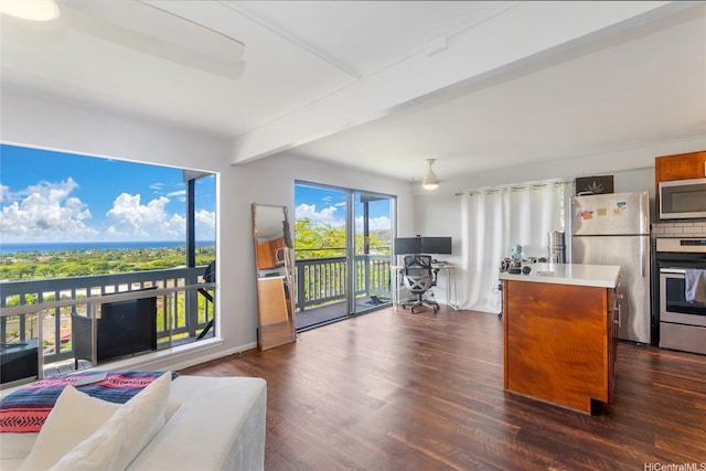 1492 Halekoa Dr, Honolulu, HI 96821 - kitchen with stainless steel appliances, dark wood-style floors, light countertops, beamed ceiling, and a center island