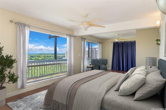 1492 Halekoa Dr, Honolulu, HI 96821 - bedroom with wood finished floors, baseboards, a ceiling fan, and access to outside