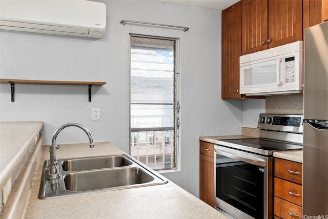 68-077 Au St Unit 3E, Waialua, HI 96791 - kitchen with stainless steel appliances, a wall mounted AC, a sink, brown cabinets, and plenty of natural light