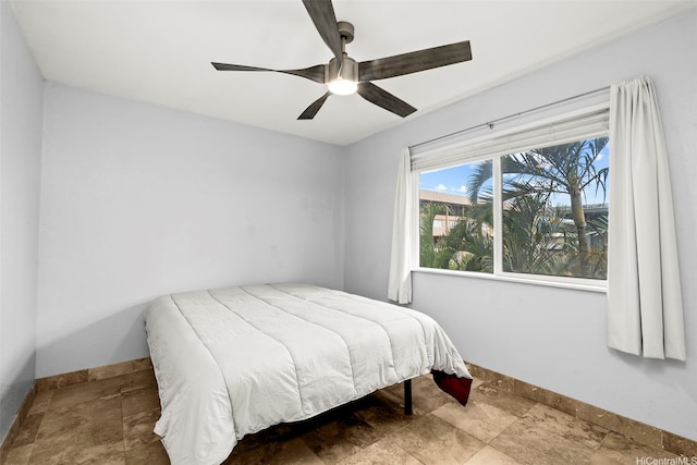 68-077 Au St Unit 3E, Waialua, HI 96791 - bedroom with stone finish floors, baseboards, and ceiling fan