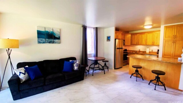 57-120 Lalo Kuilima Way Unit 2/17, Kahuku, HI 96731 - living room featuring light marble finish floors