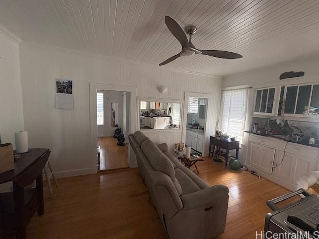 1704 Kamamalu Ave, Honolulu, HI 96813 - living area featuring a ceiling fan, crown molding, light wood-style flooring, a desk, and wooden ceiling