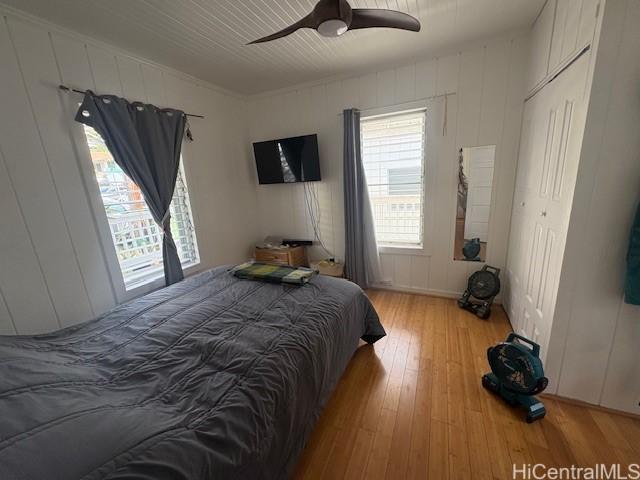1704 Kamamalu Ave, Honolulu, HI 96813 - bedroom featuring hardwood / wood-style floors, multiple windows, and a ceiling fan