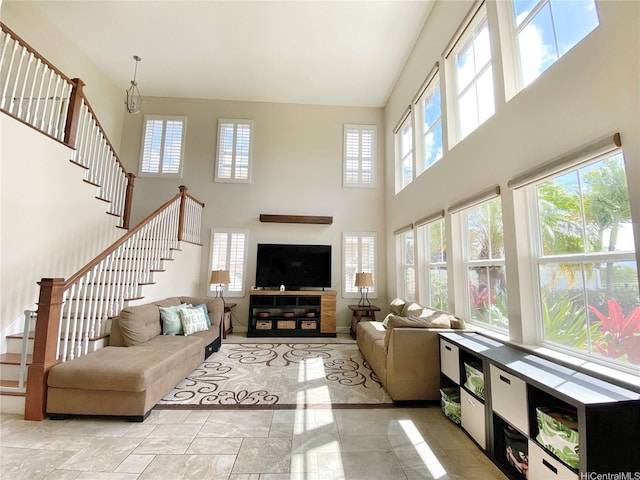 91-1103 Waikai St, Ewa Beach, HI 96706 - living area with a towering ceiling, plenty of natural light, and stairs