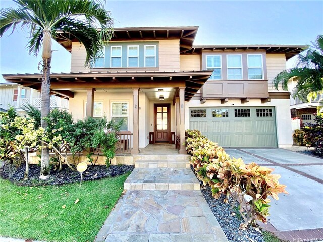 91-1103 Waikai St, Ewa Beach, HI 96706 - view of front of property with a garage, concrete driveway, stucco siding, and a porch