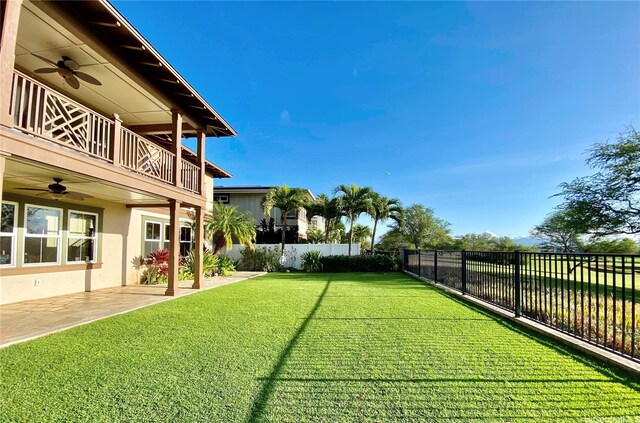 91-1103 Waikai St, Ewa Beach, HI 96706 - view of yard featuring a ceiling fan, a balcony, and a patio