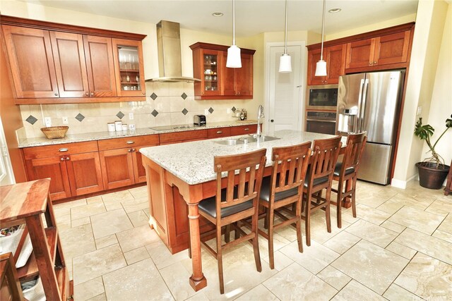 91-1103 Waikai St, Ewa Beach, HI 96706 - kitchen with wall chimney range hood, appliances with stainless steel finishes, a sink, backsplash, and an island with sink