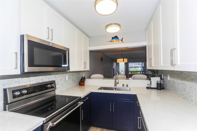 444 Lunalilo Home Rd Unit 226, Honolulu, HI 96825 - kitchen featuring appliances with stainless steel finishes, a sink, tasteful backsplash, and light countertops