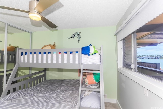 444 Lunalilo Home Rd Unit 226, Honolulu, HI 96825 - bedroom featuring a textured ceiling and a ceiling fan
