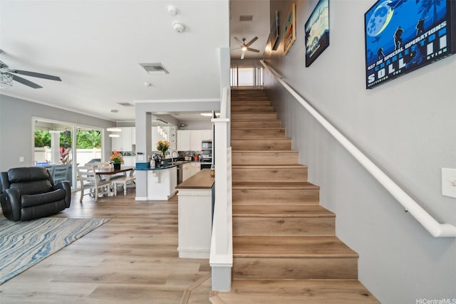 91-2222 Kanela St Unit T88, Ewa Beach, HI 96706 - staircase with ceiling fan, crown molding, and wood finished floors