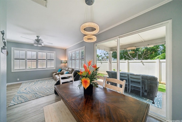 91-2222 Kanela St Unit T88, Ewa Beach, HI 96706 - dining space with wood finished floors, baseboards, ceiling fan, and crown molding