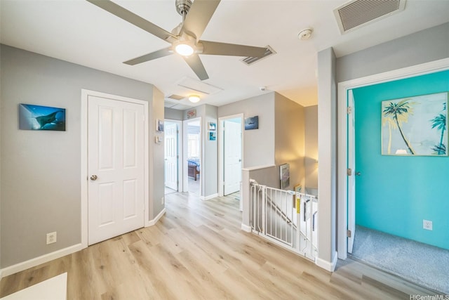 91-2222 Kanela St Unit T88, Ewa Beach, HI 96706 - hall featuring an upstairs landing, light wood-type flooring, and baseboards