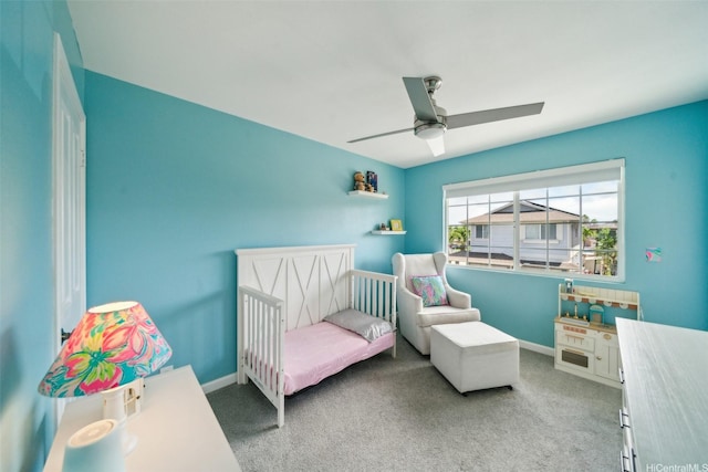 91-2222 Kanela St Unit T88, Ewa Beach, HI 96706 - carpeted bedroom with ceiling fan, baseboards, and a crib