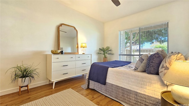 91-540 Puamaeole St Unit 49D, Ewa Beach, HI 96706 - bedroom with wood finished floors, baseboards, and a ceiling fan