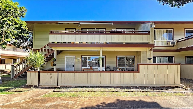 91-540 Puamaeole St Unit 49D, Ewa Beach, HI 96706 - rear view of house featuring a balcony and cooling unit
