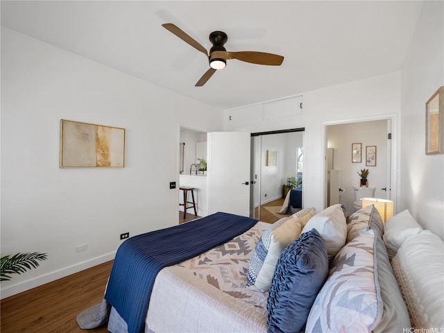 91-540 Puamaeole St Unit 49D, Ewa Beach, HI 96706 - bedroom with wood finished floors, a closet, connected bathroom, and a ceiling fan