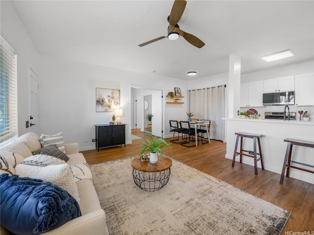91-540 Puamaeole St Unit 49D, Ewa Beach, HI 96706 - living room featuring a ceiling fan and wood finished floors