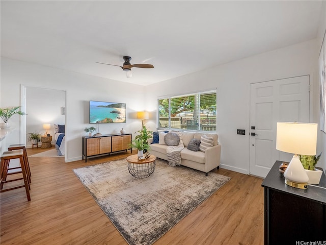 91-540 Puamaeole St Unit 49D, Ewa Beach, HI 96706 - living area featuring a ceiling fan and light wood-style flooring