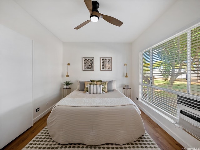 91-540 Puamaeole St Unit 49D, Ewa Beach, HI 96706 - bedroom with wood finished floors and ceiling fan