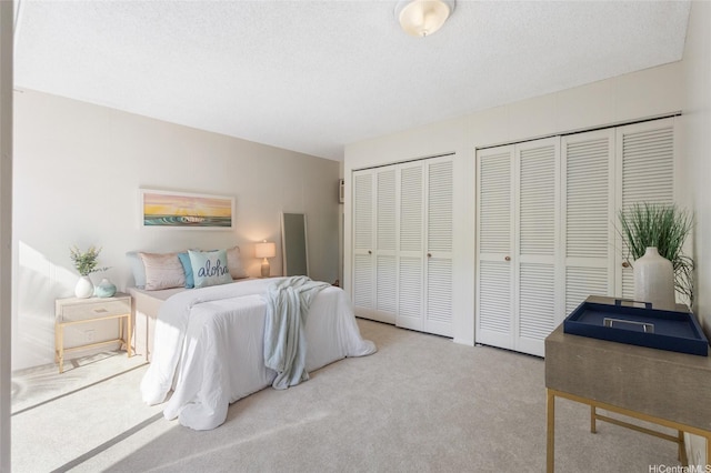 1630 Kalaniiki St Unit 31, Honolulu, HI 96821 - bedroom with multiple closets and carpet floors