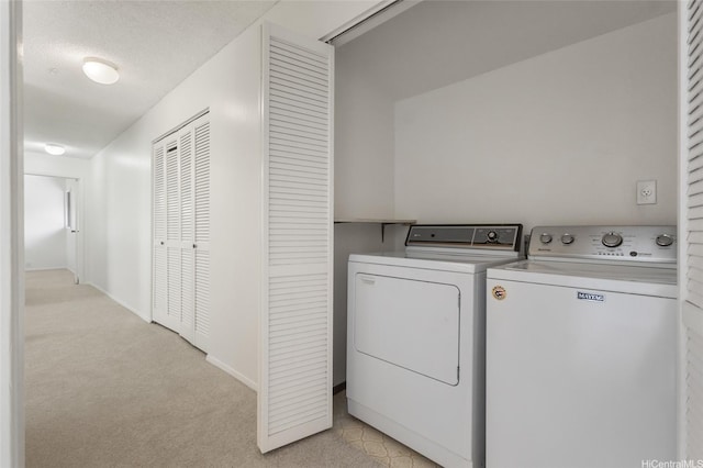 1630 Kalaniiki St Unit 31, Honolulu, HI 96821 - laundry area with washer and dryer, light carpet, and baseboards