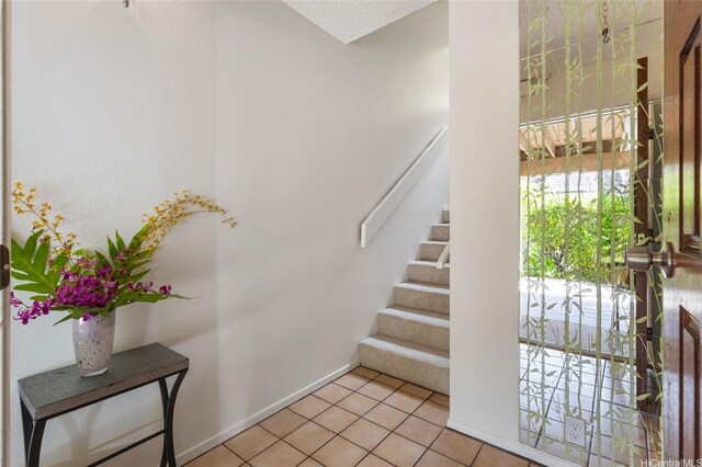 1630 Kalaniiki St Unit 31, Honolulu, HI 96821 - stairs featuring tile patterned floors and baseboards