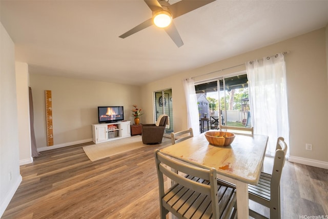 92-1210 Makakilo Dr Unit 5, Kapolei, HI 96707 - dining area with wood finished floors, baseboards, and a ceiling fan