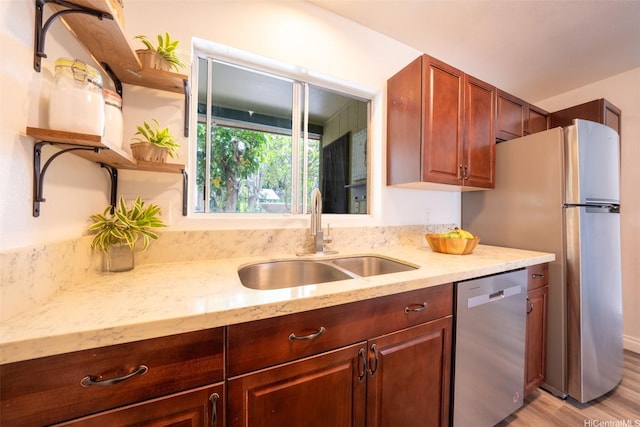 92-1210 Makakilo Dr Unit 5, Kapolei, HI 96707 - kitchen with dishwasher, a sink, open shelves, light stone countertops, and light wood-style flooring