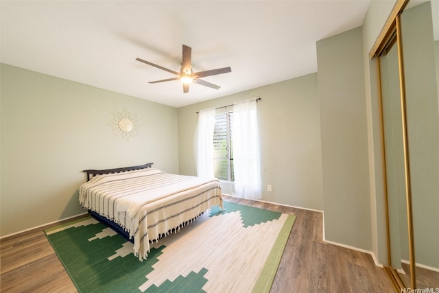 92-1210 Makakilo Dr Unit 5, Kapolei, HI 96707 - bedroom featuring wood finished floors, a closet, and a ceiling fan