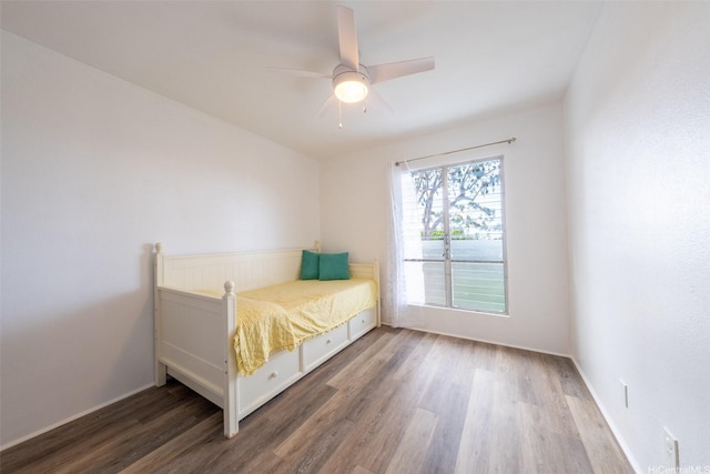 92-1210 Makakilo Dr Unit 5, Kapolei, HI 96707 - bedroom featuring wood finished floors, a ceiling fan, and baseboards
