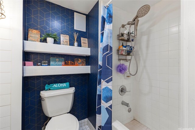 419 Keoniana St Unit 1003, Honolulu, HI 96815 - full bathroom with tiled shower, toilet, and tile walls