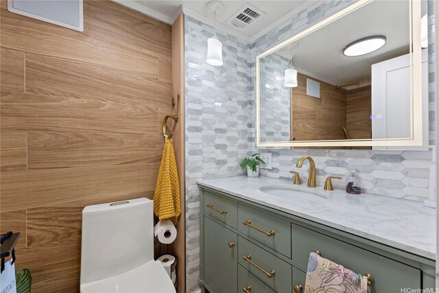 419 Keoniana St Unit 1003, Honolulu, HI 96815 - bathroom with ornamental molding, tasteful backsplash, and vanity