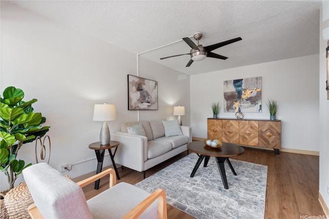 1670 Kalakaua Ave Unit 205, Honolulu, HI 96826 - living room featuring ceiling fan, a textured ceiling, and wood finished floors