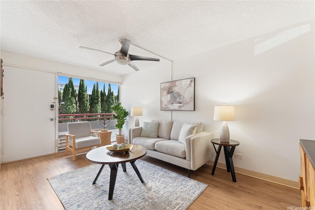 1670 Kalakaua Ave Unit 205, Honolulu, HI 96826 - living area featuring a textured ceiling, a ceiling fan, and light wood-type flooring