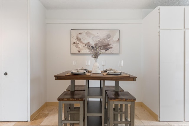1670 Kalakaua Ave Unit 205, Honolulu, HI 96826 - dining room with baseboards and light tile patterned flooring