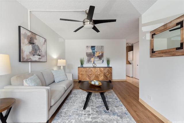 1670 Kalakaua Ave Unit 205, Honolulu, HI 96826 - living room featuring ceiling fan, wood finished floors, and a textured ceiling