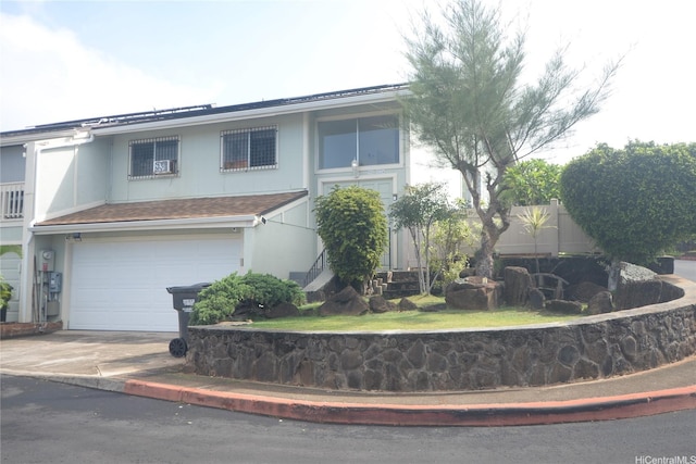 98-524 Lulu Pl Unit 84, Aiea, HI 96701 - view of front of house with a garage, driveway, and stucco siding