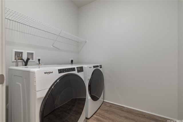 91-1785 Kohanahana Loop, Ewa Beach, HI 96706 - laundry room with washing machine and dryer, wood finished floors, and baseboards