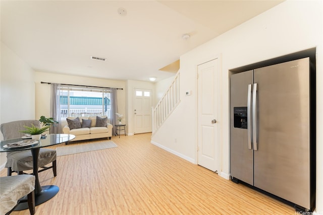91-1031 Kaimalie St Unit 4P4, Ewa Beach, HI 96706 - living room with light wood-style flooring, stairway, and baseboards