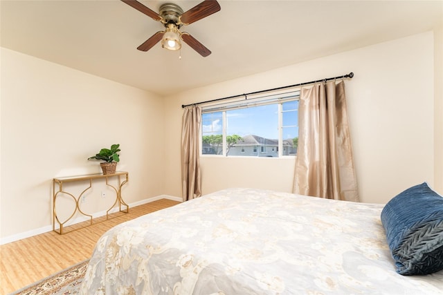 91-1031 Kaimalie St Unit 4P4, Ewa Beach, HI 96706 - bedroom with wood finished floors, baseboards, and ceiling fan