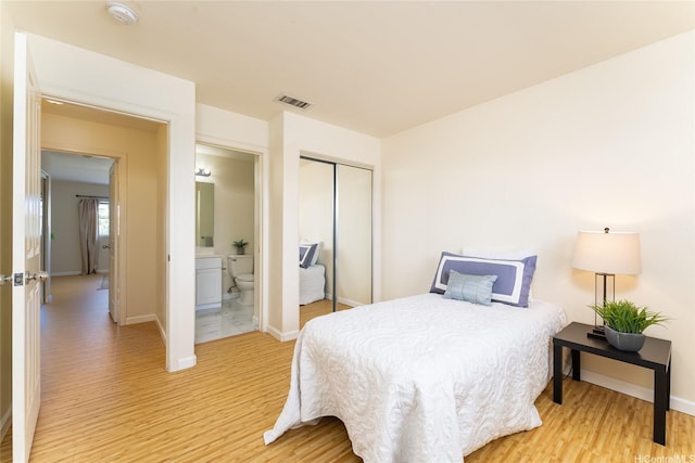 91-1031 Kaimalie St Unit 4P4, Ewa Beach, HI 96706 - bedroom with light wood-style flooring, a closet, and baseboards